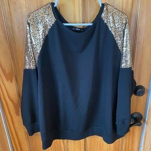 Black shirt with gold sequin sleeve detail